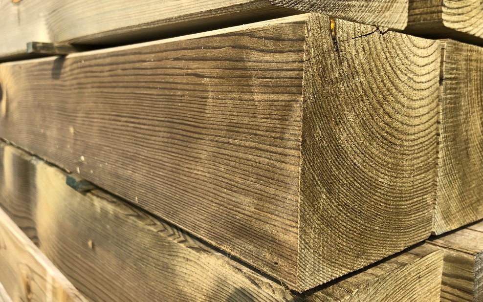 Close-up of pressure-treated square timber
