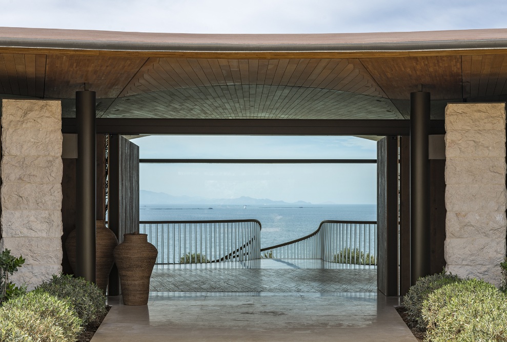 View through a door of the private villa to the sea.